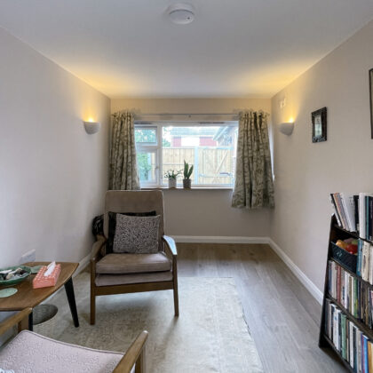 Converted garage home office with comfortable seating area, natural light and modern finishes as part of a Whitstable home renovation.